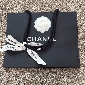 CHANEL Black Shopping Tote with White Flower and Ribbon